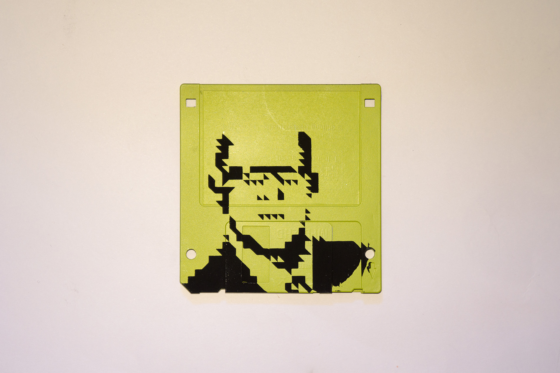 Silkscren of Klaus on a 3.5" floppy disk. Contemporary artwork- light green version