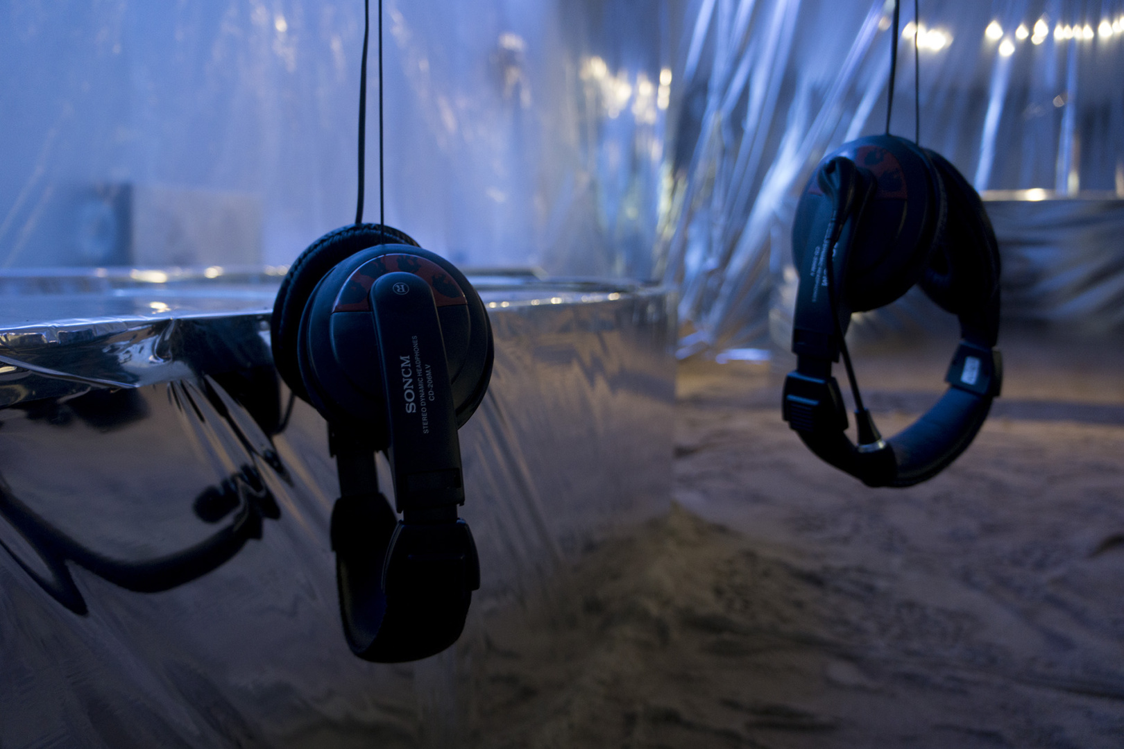 Headphones hanging from the tree inside the installation