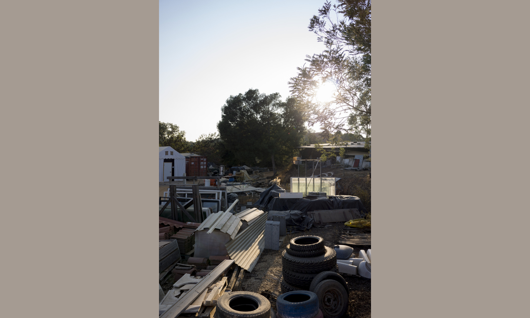 A small junk yard in the middle of an ecovillage