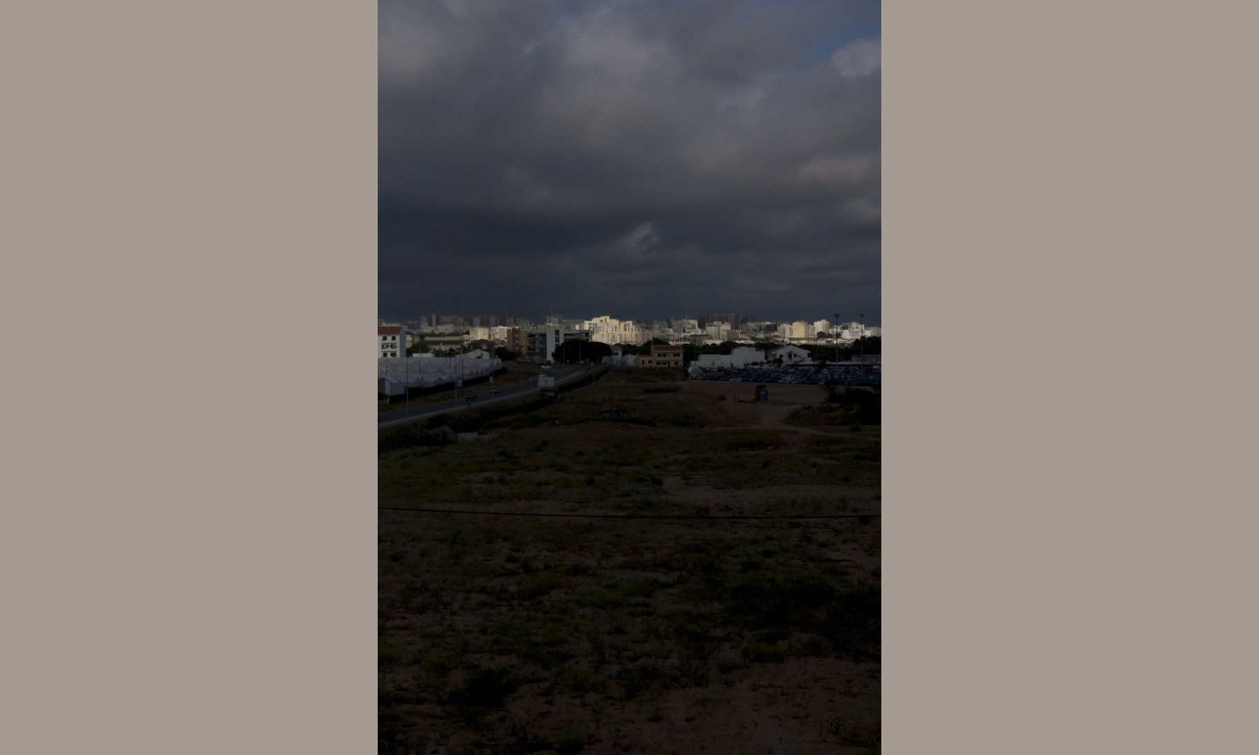 Sunlight during a storm at the city of Faro, Portugal