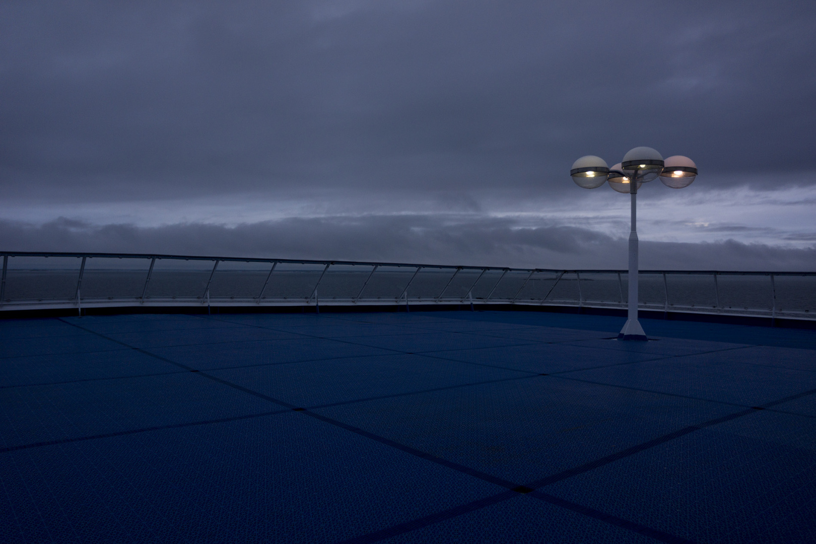 The stern of a ferry after sundown