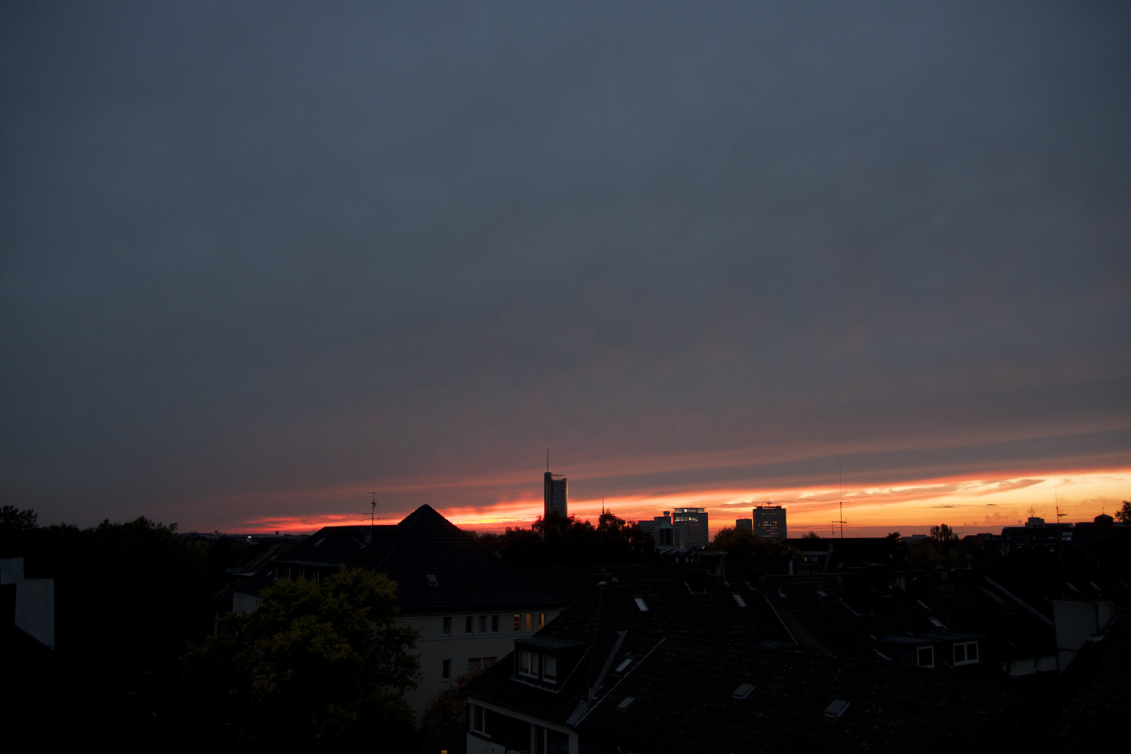 Sundown in Essen showing RWE Tower, Evonic and a blimps