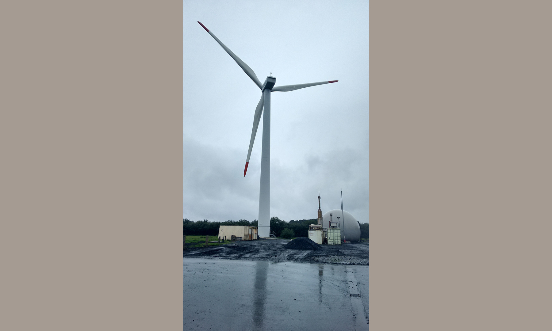 A wind turbine at a biogas plant