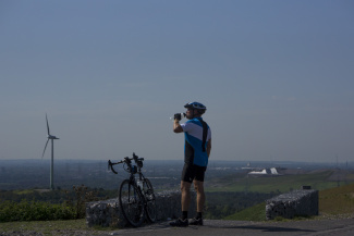 Time for a drink, a bicycle rider takes a rest