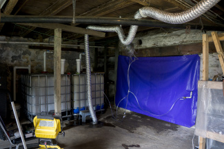 A biogas plant and a PVC storage bag in the basement of a house