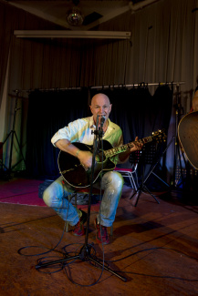 A musician performing a song at the Unperfekthaus in Essen A musician performing a song at the Unperfekthaus in Essen