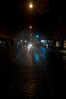 Waiting for the bus in a cold dark morning