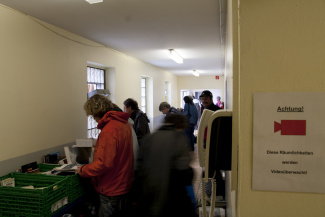 People looking for books at the book thrift of the animal shelter in Essen, Germany