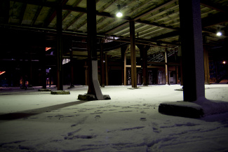 snowed in pillars at a industrial building during winter time