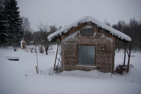 tontun talo - snow on a small building 