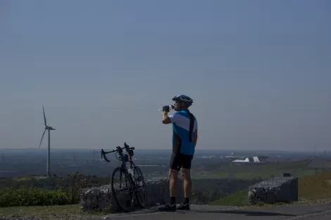 Time for a drink, a bicycle rider takes a rest