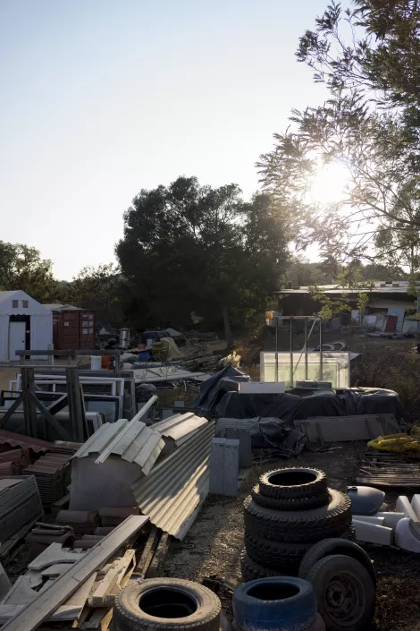 A small junk yard in the middle of an ecovillage