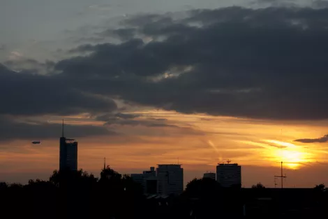 Sundown in Essen showing RWE Tower, Evonic and a blimps